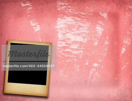 old blank photo frame with against rough background