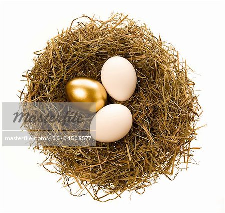 Two simple and one gold eggs lay in a nest