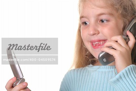 happy young girl talking on a cell phone looking at another phone