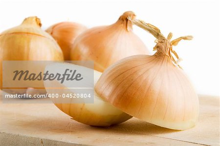 A group of onions on a cutting board