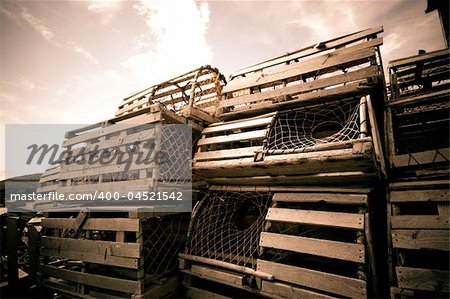 A view of a stack of lobster pots near the ocean in a rural Newfoundland community on the Bonavista peninsula.