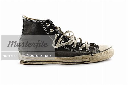 Old grungy sneakers isolated on white background