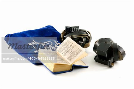 Tefillin - phylacteries worn by Jewish men for morning prayers, Siddur - Jewish prayerbook and bag isolated on white