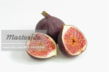 Two fres and ripe figs on bright background