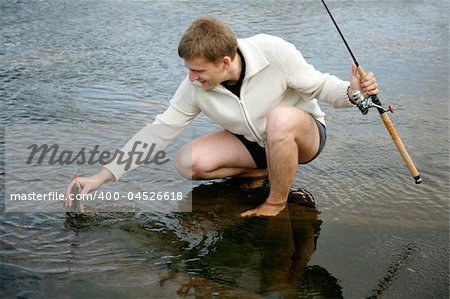 man catching fish