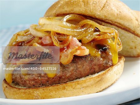 A juicy sirloin burger topped with cheddar cheese, bacon, barbecue sauce, and sauteed onions. Served on a toasted wheat bun.