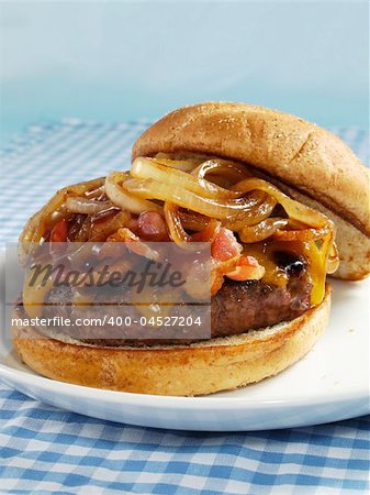 A juicy sirloin burger topped with cheddar cheese, bacon, barbecue sauce, and sauteed onions. Served on a toasted wheat bun.