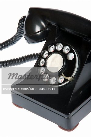 Close-up of vintage retro rotary telephone on white background