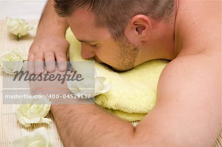 man relaxing in spa salon
