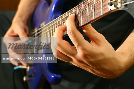 man play solo on blue guitar