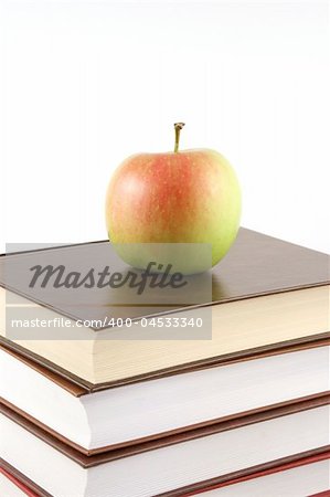 books pyramid with apple on top