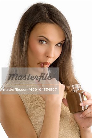 sensual girl sucking her finger with some chocolate cream on
