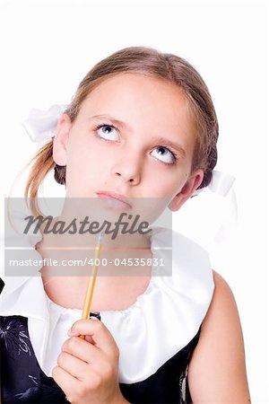 Puzzled pretty schoolgirl with pencil looking up