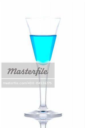 Glass of blue paradise cocktail reflected on white background