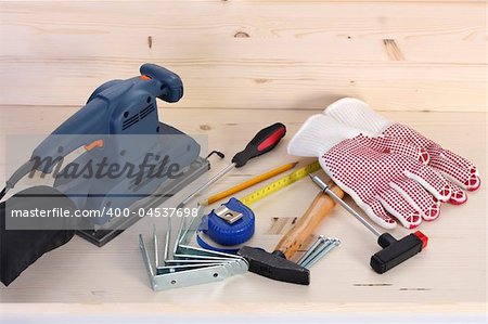 details of work tools on wooden plank