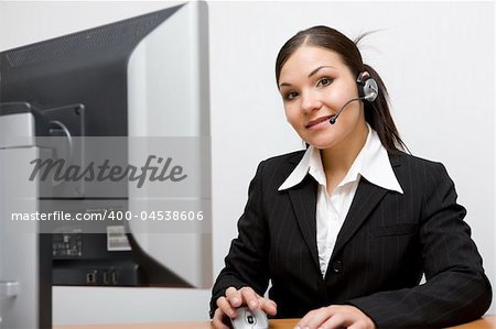 happy businesswoman at desk with headphone