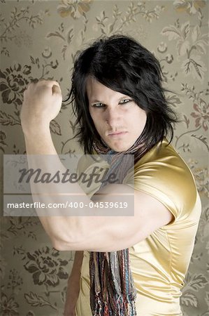 Young Man in a Yellow Shirt Flexing his Bicep
