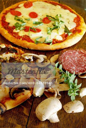 Rustic mushroom and roasted garlic pizza on a vintage oak table