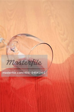 wine spilled on wood - red wine glass toppled over