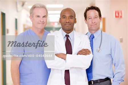 Doctors Standing In A Hospital Corridor