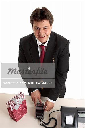 A man dressed in suit buying a birthday, Christmas or special occasion present using credit or debit card.