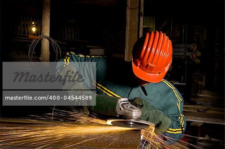 heavy industry worker with grinder