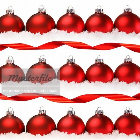 Red christmas balls with snow isolated on white background