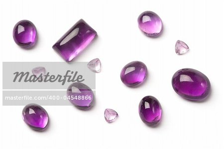 Few different cut purple amethyst gems.