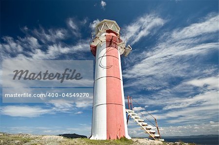 A wide angle shot of a small community lighthouse on the outskirts of Brigus, Newfoundland Canada.