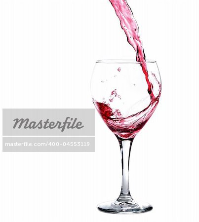 Glass of Red Merlot Wine Splashing While Being Poured