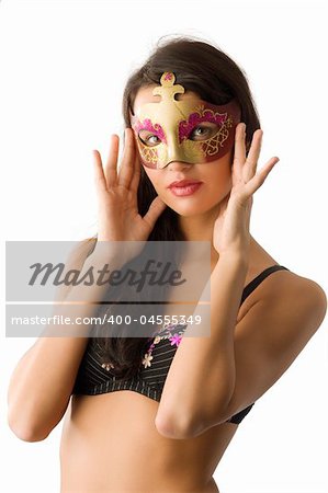 sensual young brunette in bra with a carnival mask