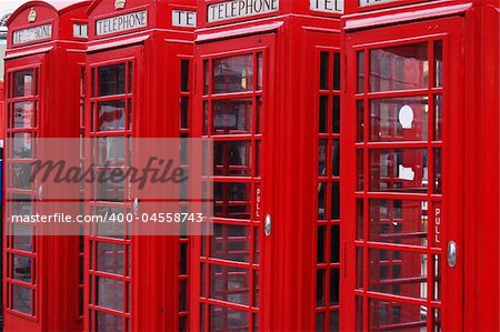 Four classic London telephone cabins. London symbol