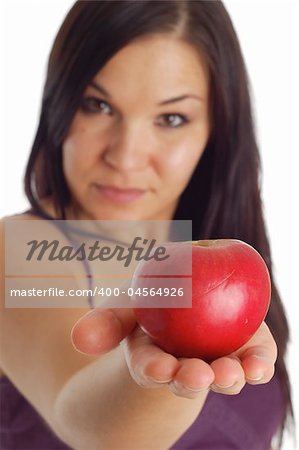 attractive brunette woman with apple on white background