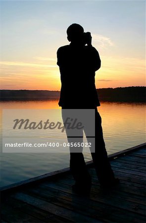 photographer capturing sunset