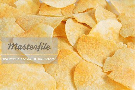 Background of chips and crisps with flavoring powder