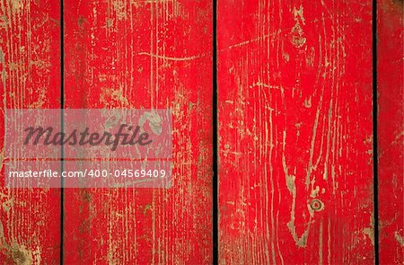 Wood with chipped red paint. Grunge style background