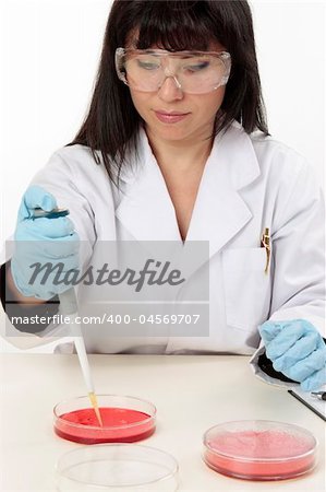 Female biologist, pathologist or other scientific worker conducting diagnostic or laboratory research
