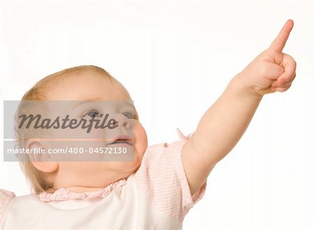 Small nice girl shows a finger upwards on a white background