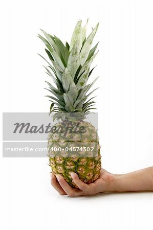 Womans hand with pineapple on bright background