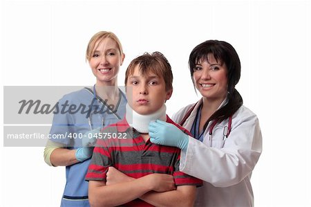 Smiling medical doctor and nurse and child fitted with a cervical collar.