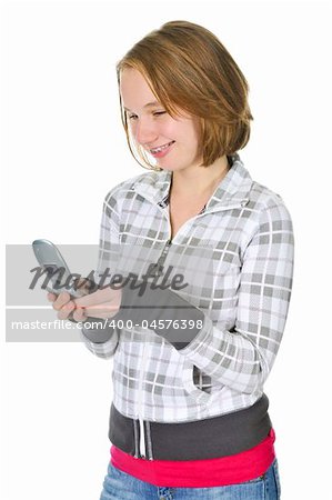 Teenage girl text messaging on a cell phone isolated on white background