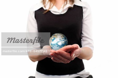 Studio lite shot of a business woman with a globe in her habd