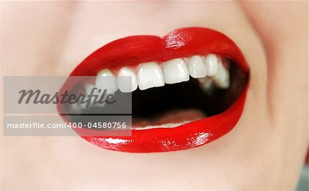 woman opened mouth white teeth and red lipstick laughing