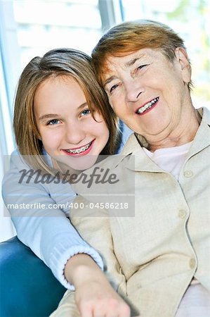 Granddaughter giving a hug to her grandmother