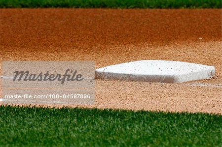 The 3rd base bag on a baseball diamond