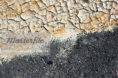 Fragment of  orange clay and salt mineral deposits in geological formations in Ubehebe Volcano, Death Valley National Park