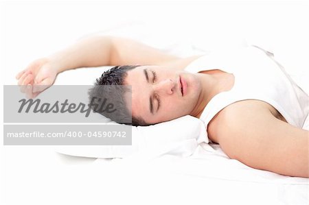 Man sleeping on white bed