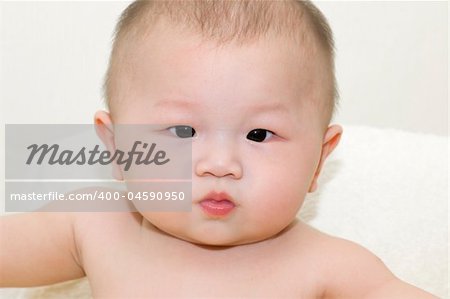 Horizontal portrait of a adorable 6-month-old Asian baby boy