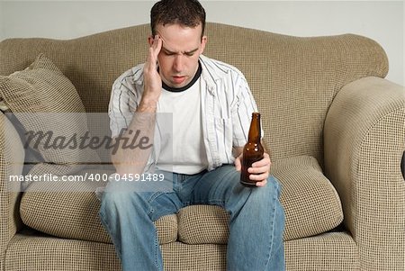 A young man with a drinking problem is feeling depressed