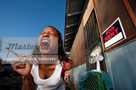 African-American woman in front of rental house